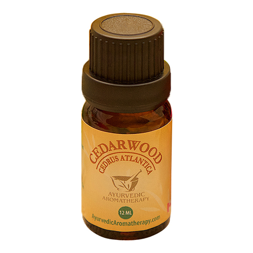 Ayurvedic Aromatherapy Cedarwood Essential Oil on white background
