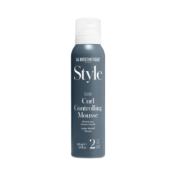 Curl Controlling Mousse on white background