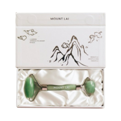 The De-Puffing Facial Roller - Jade on white background